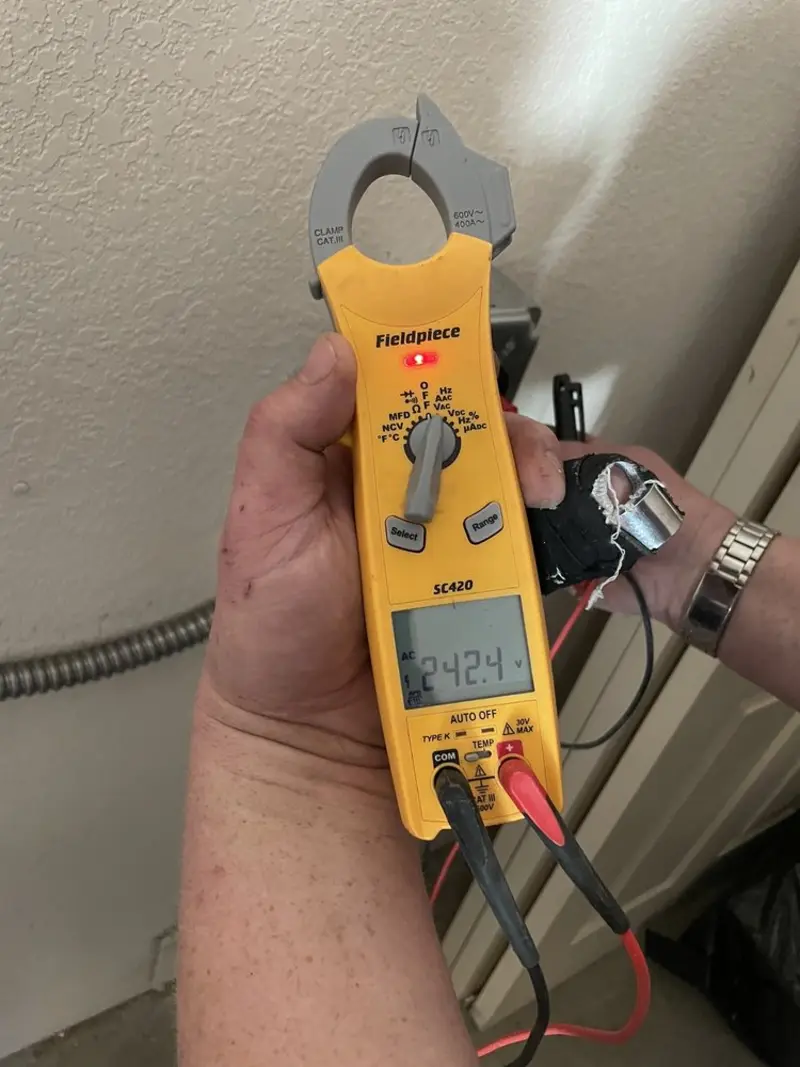 Voltage testing with clamp meter during Ceiling Fan Installation in Alabaster